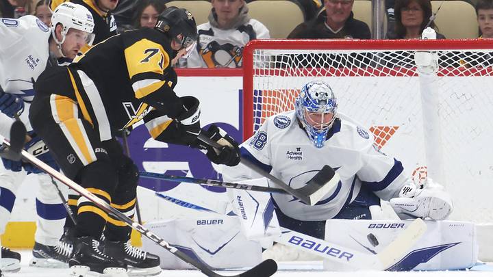 Jan 13, 2026; Pittsburgh, Pennsylvania, USA;  Tampa Bay Lightning goaltender Andrei Vasilevskiy (88) makes a save against Pittsburgh Penguins center Evgeni Malkin (71) during the first period at PPG Paints Arena. Mandatory Credit: Charles LeClaire-Imagn Images