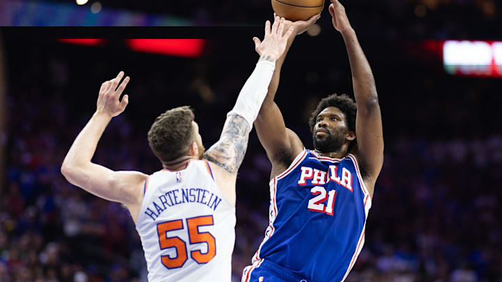 May 2, 2024; Philadelphia, Pennsylvania, USA; Philadelphia 76ers center Joel Embiid (21) shoots the ball against New York Knicks center Isaiah Hartenstein (55) during the second half of game six of the first round for the 2024 NBA playoffs at Wells Fargo Center. Mandatory Credit: Bill Streicher-Imagn Images