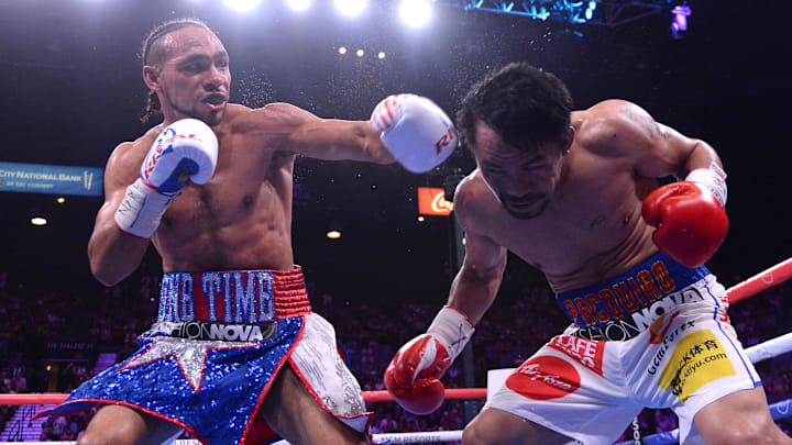 Manny Pacquiao (white trunks) and Keith Thurman (red/white/blue trunks) box during their WBA welterweight championship bout at MGM Grand Garden Arena. Pacquiao won via split decision. 