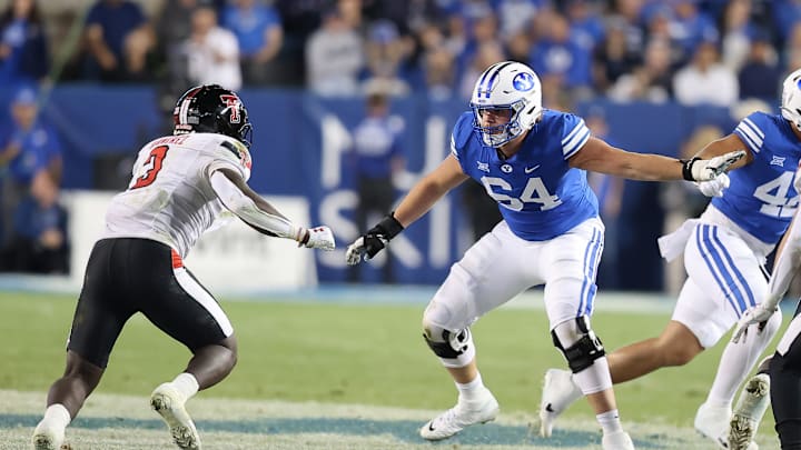 Oct 21, 2023; Provo, Utah, USA; Brigham Young Cougars offensive lineman Paul Maile (54) blocks Texas Tech Red Raiders linebacker Bryce Ramirez (3) in the second half at LaVell Edwards Stadium. Mandatory Credit: Rob Gray-Imagn Images