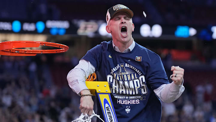 Apr 8, 2024; Glendale, AZ, USA;  Connecticut Huskies head coach Dan Hurley celebrates after cutting down the net after defeating the Purdue Boilermakers in the national championship game of the Final Four of the 2024 NCAA Tournament at State Farm Stadium. Mandatory Credit: Robert Deutsch-Imagn Images