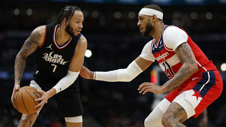 Jan 31, 2024; Washington, District of Columbia, USA; LA Clippers guard Amir Coffey (7) holds the ball as Washington Wizards center Daniel Gafford (21) defends in the second half at Capital One Arena. Mandatory Credit: Geoff Burke-Imagn Images Jan 31, 2024; Washington, District of Columbia, USA; LA Clippers guard Amir Coffey (7) holds the ball as Washington Wizards center Daniel Gafford (21) defends in the second half at Capital One Arena. Mandatory Credit: Geoff Burke-Imagn Images