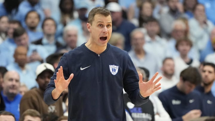 Duke basketball head coach Jon Scheyer vs. UNC
