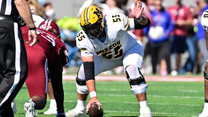 Oct 12, 2024; Amherst, Massachusetts, USA; Missouri Tigers offensive lineman Connor Tollison (55) snaps the ball during the first half against the Massachusetts Minutemen at Warren McGuirk Alumni Stadium. Mandatory Credit: Eric Canha-Imagn Images