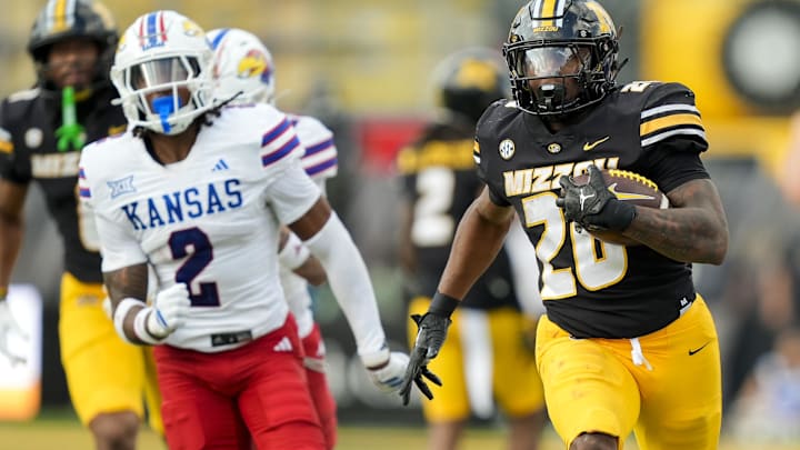Missouri Tigers running back Jamal Roberts (20) runs for a touchdown in a game against the Kansas Jayhawks this season.