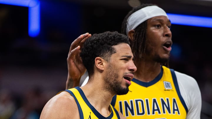 Apr 4, 2025; Indianapolis, Indiana, USA; Indiana Pacers guard Tyrese Haliburton (0) reacts to a basket and foul with center Myles Turner (33) in the second half against the Utah Jazz at Gainbridge Fieldhouse. Mandatory Credit: Trevor Ruszkowski-Imagn Images
