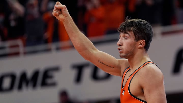 Oklahoma State's Dean Hamiti Jr. celebrates his win over Air Force's Jack Ganos in the 174-pound match during the college wrestling dual between Oklahoma State and Air Force at Gallagher-Iba Arena in Stillwater, Okla., Friday, Jan., 3, 2025. Oklahoma State's Dean Hamiti Jr. celebrates his win over Air Force's Jack Ganos in the 174-pound match during the college wrestling dual between Oklahoma State and Air Force at Gallagher-Iba Arena in Stillwater, Okla., Friday, Jan., 3, 2025.