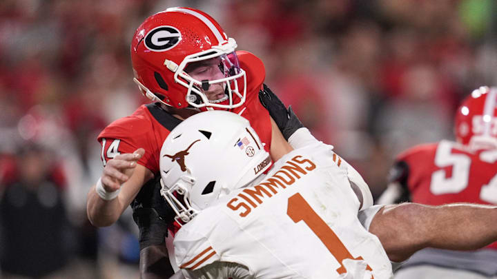 Texas Longhorns defensive end Colin Simmons (1) tackles Georgia Bulldogs quarterback Gunner Stockton (14) in the second half at Sanford Stadium. Mandatory Credit: Dale Zanine-Imagn Images Texas Longhorns defensive end Colin Simmons (1) tackles Georgia Bulldogs quarterback Gunner Stockton (14) in the second half at Sanford Stadium. Mandatory Credit: Dale Zanine-Imagn Images