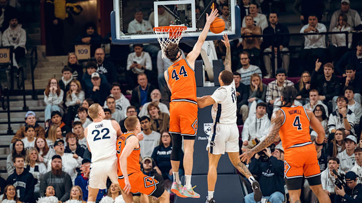 Illinois center Zvonimir Ivisic (44) blocks a shot at the rim from Penn State guard Eli Rice (11) during the Illini's 73-65 win over the Nittany Lions on Saturday at The Palestra in Philadelphia.