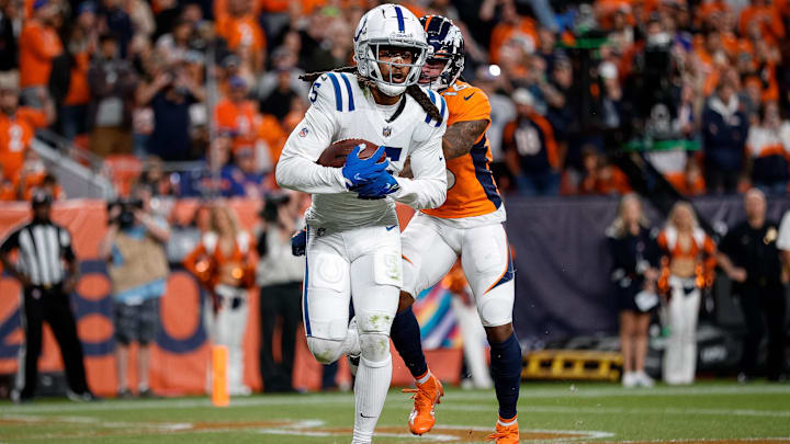 Oct 6, 2022; Denver, Colorado, USA; Indianapolis Colts cornerback Stephon Gilmore (5) intercepts a pass intended for Denver Broncos wide receiver Tyrie Cleveland (16) in the fourth quarter at Empower Field at Mile High. Mandatory Credit: Isaiah J. Downing-Imagn Images Oct 6, 2022; Denver, Colorado, USA; Indianapolis Colts cornerback Stephon Gilmore (5) intercepts a pass intended for Denver Broncos wide receiver Tyrie Cleveland (16) in the fourth quarter at Empower Field at Mile High. Mandatory Credit: Isaiah J. Downing-Imagn Images