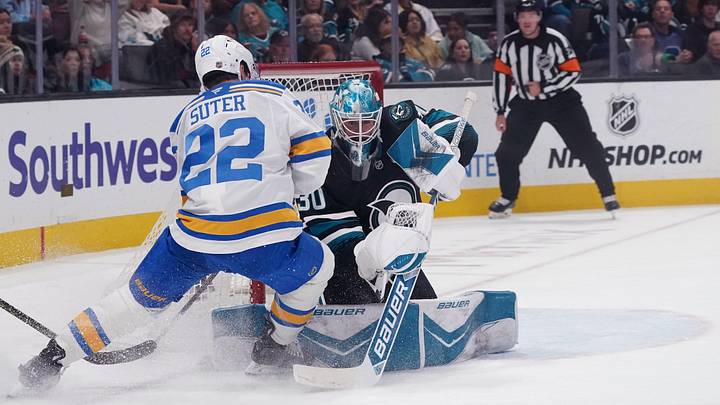Mar 30, 2026; San Jose, California, USA;  San Jose Sharks goaltender Yaroslav Askarov (30) deflects the puck from St. Louis Blues center Pius Suter (22) in the first period at SAP Center at San Jose. Mandatory Credit: David Gonzales-Imagn Images