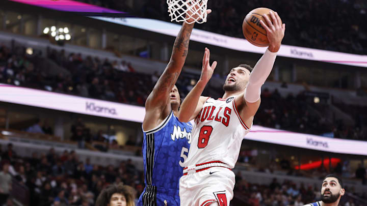 Chicago Bulls guard Zach LaVine (8) goes to the basket against Orlando Magic forward Paolo Banchero (5) during the first half at United Center. Chicago Bulls guard Zach LaVine (8) goes to the basket against Orlando Magic forward Paolo Banchero (5) during the first half at United Center.
