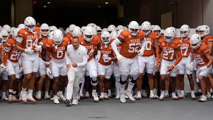 Texas Longhorns head coach Steve Sarkisian leads his team on to the field before a game against the Sam Houston State Bearkats.