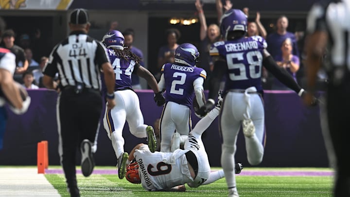 Sep 21, 2025; Minneapolis, Minnesota, USA; Minnesota Vikings cornerback Isaiah Rodgers (2) runs with the ball for a touchdown after a fumble recovery as Cincinnati Bengals quarterback Jake Browning (6) attempts to make a tackle during the first half at U.S. Bank Stadium. Mandatory Credit: Jeffrey Becker-Imagn Images