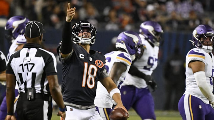 Caleb Williams reacts after scrambling for a first down in the first game against Minnesota.