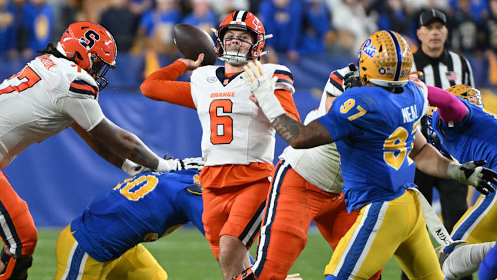 Oct 24, 2024; Pittsburgh, Pennsylvania, USA; Syracuse Orange quarterback Kyle McCord (6) throws a pass during the first quarter in front of Pittsburgh Panthers defensive lineman Isaiah Neal (97) at Acrisure Stadium. Mandatory Credit: Barry Reeger-Imagn Images