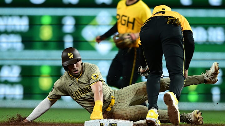 May 2, 2025; Pittsburgh, Pennsylvania, USA; San Diego Padres center fielder Tyler Wade (14) is tagged out by Pittsburgh Pirates short stop Jared Triolo (19) attempting to steal second base during the fourth inning at PNC Park. Mandatory Credit: David Dermer-Imagn Images