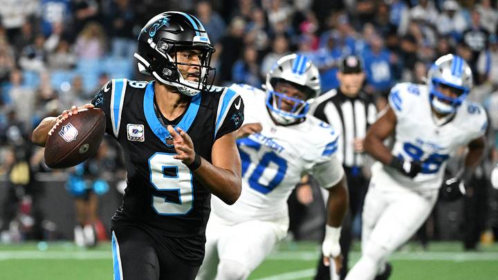 Carolina Panthers quarterback Bryce Young (9) scrambles with the ball against the Detroit Lions during the fourth quarter at Bank of America Stadium. 