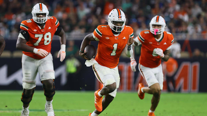 Sep 27, 2024; Miami Gardens, Florida, USA; Miami Hurricanes quarterback Cam Ward (1) runs with the football against the Virginia Tech Hokies during the third quarter at Hard Rock Stadium. Mandatory Credit: Sam Navarro-Imagn Images Sep 27, 2024; Miami Gardens, Florida, USA; Miami Hurricanes quarterback Cam Ward (1) runs with the football against the Virginia Tech Hokies during the third quarter at Hard Rock Stadium. Mandatory Credit: Sam Navarro-Imagn Images