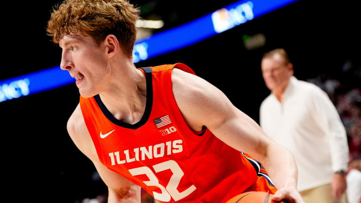 Nov 20, 2024; Birmingham, AL, USA; Illinois guard Kasparas Jakucionis (32) sticks out his tongue as he drives into the lane in the CM Newton Classic at Legacy Arena. Alabama defeated Illinois 100-87. Mandatory Credit: Gary Cosby Jr.-Tuscaloosa News