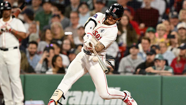 Jun 2, 2025; Boston, Massachusetts, USA; Boston Red Sox outfielder Jarren Duran (16) hits a double against the Los Angeles Angels during the fifth inning at Fenway Park. Mandatory Credit: Brian Fluharty-Imagn Images
