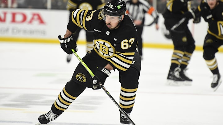May 17, 2024; Boston, Massachusetts, USA; Boston Bruins left wing Brad Marchand (63) controls the puck during the third period in game six of the second round of the 2024 Stanley Cup Playoffs against the Florida Panthers at TD Garden. Mandatory Credit: Bob DeChiara-Imagn Images
