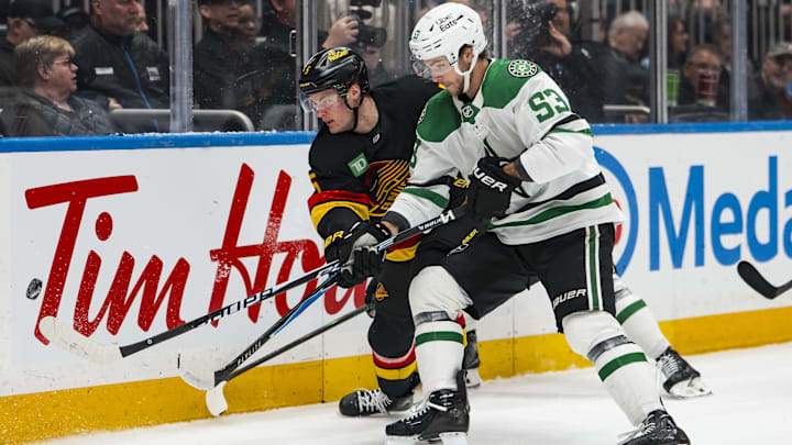 Mar 2, 2026; Vancouver, British Columbia, CAN; Dallas Stars forward Wyatt Johnston (53) checks Vancouver Canucks defenseman Tom Willander (5) in the first period at Rogers Arena. Mandatory Credit: Bob Frid-Imagn Images