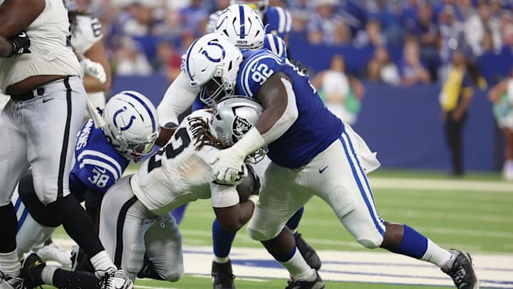 Neville Gallimore tackles Raiders running back Ashton Jeanty last season in Indianapolis.