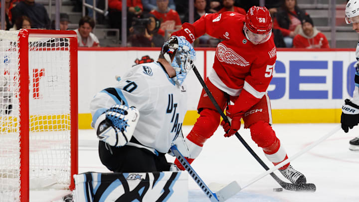 Dec 17, 2025; Detroit, Michigan, USA;  Detroit Red Wings center Emmitt Finnie (58) looks to shoot on Utah Mammoth goaltender Karel Vejmelka (70) in the second period at Little Caesars Arena. Mandatory Credit: Rick Osentoski-Imagn Images