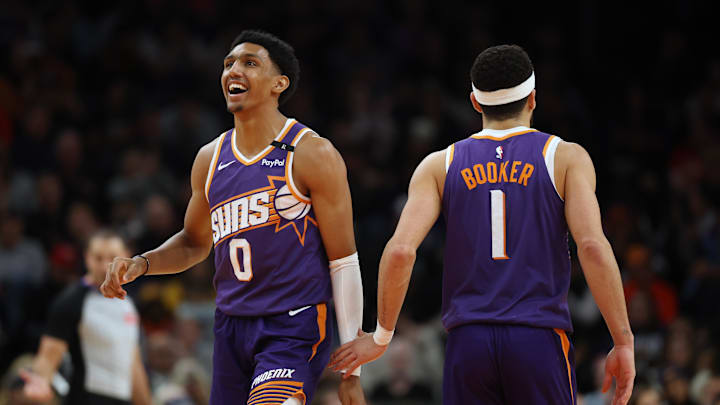 Jan 9, 2025; Phoenix, Arizona, USA; Phoenix Suns forward Ryan Dunn (0) and guard Devin Booker (1) against the Atlanta Hawks in the second half at Footprint Center. Mandatory Credit: Mark J. Rebilas-Imagn Images