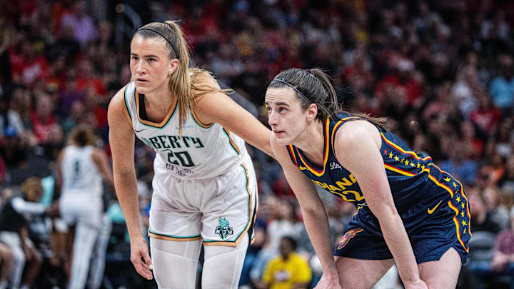 New York Liberty guard Sabrina Ionescu (20) and Indiana Fever guard Caitlin Clark (22)  in the second half at Gainbridge Fieldhouse.