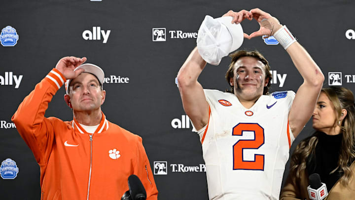 Dec 7, 2024; Charlotte, NC, USA; Clemson Tigers head coach Dabo Swinney, and quarterback Cade Klubnik (2) celebrate after winning the 2024 ACC Championship game against the Southern Methodist Mustangs at Bank of America Stadium.