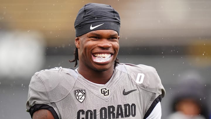 Apr 27, 2024; Boulder, CO, USA; Colorado Buffaloes cornerback Travis Hunter (12) warms up before a spring game event at Folsom Field. Mandatory Credit: Ron Chenoy-Imagn Images