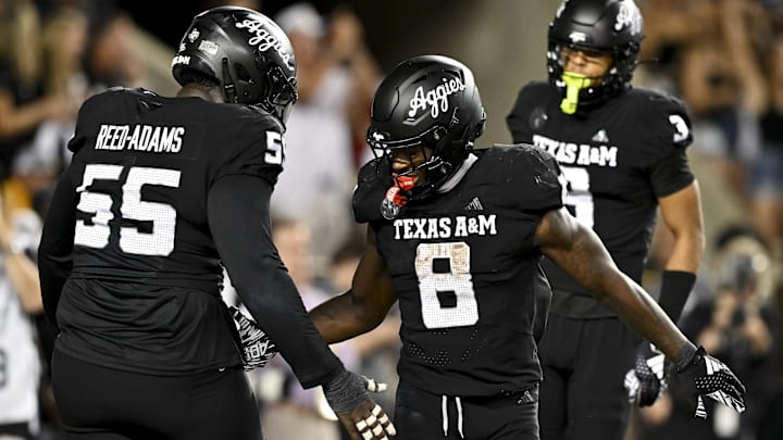 Oct 26, 2024; College Station, Texas, USA; Texas A&M Aggies running back Le'Veon Moss (8) reacts after scoring a touchdown against the LSU Tigers in the fourth quarter at Kyle Field. Mandatory Credit: Maria Lysaker-Imagn Images. 