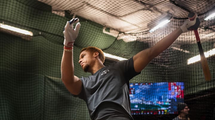 Red Sox prospect Kristian Campbell takes some swings inside the batting cage at Fenway Park on Tuesday.