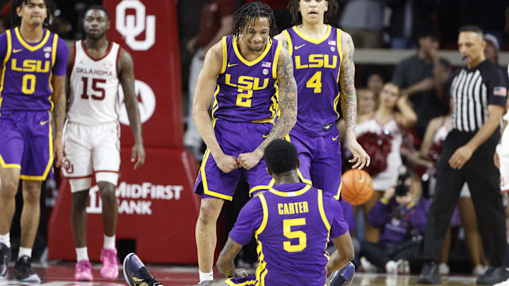 Feb 15, 2025; Norman, Oklahoma, USA; LSU Tigers guard Mike Williams III (2) reacts after guard Cam Carter (5) scores against the Oklahoma Sooners during the second half at Lloyd Noble Center. Mandatory Credit: Alonzo Adams-Imagn Images Feb 15, 2025; Norman, Oklahoma, USA; LSU Tigers guard Mike Williams III (2) reacts after guard Cam Carter (5) scores against the Oklahoma Sooners during the second half at Lloyd Noble Center. Mandatory Credit: Alonzo Adams-Imagn Images