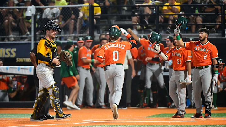 Miami Hurricanes second baseman Dorian Gonzalez, Jr. (0) scores against the Southern Miss Golden Eagles during the final game of the 2025 NCAA Hattiesburg Regional game at Pete Taylor Park in Hattiesburg, Mississippi, on June 2, 2025.