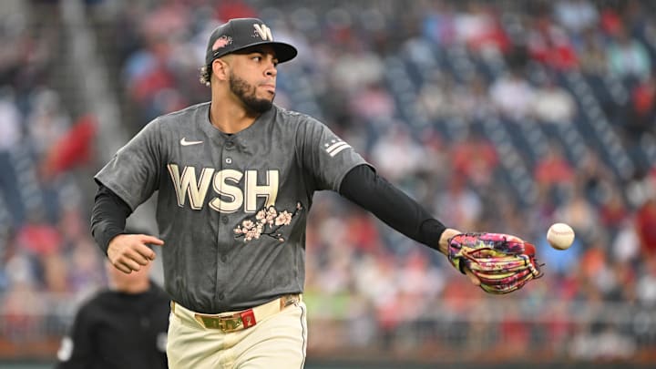 Sep 29, 2024; Washington, District of Columbia, USA; Washington Nationals second baseman Luis Garcia Jr. (2) tosses the ball out of his glove against the Philadelphia Phillies during the eighth inning at Nationals Park.