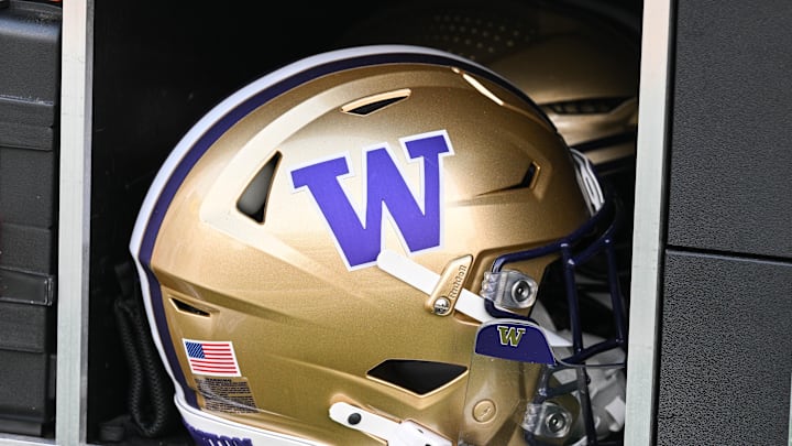 Oct 12, 2024; Iowa City, Iowa, USA;  A Washington Huskies helmet sits ready on the sidelines before the game against the Iowa Hawkeyes at Kinnick Stadium. Mandatory Credit: Jeffrey Becker-Imagn Images