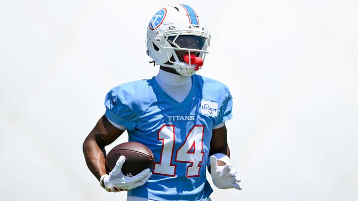 Jun 16, 2026; Nashville, TN, USA;  Tennessee Titans wider receiver Carnell Tate (14) runs with the ball after a made catch during day 1 of mini-camp at Vanderbilt Health Football Center. Mandatory Credit: Steve Roberts-Imagn Images