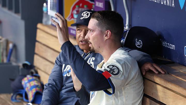May 9, 2026; Los Angeles, California, USA;  Los Angeles Dodgers pitcher Blake Snell (7) talks with manager Dave Roberts (30) in the dugout in the fourth inning against the Atlanta Braves at Dodger Stadium. Mandatory Credit: Kiyoshi Mio-Imagn Images