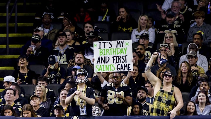 Dec 10, 2023; New Orleans, Louisiana, USA; A Saints fan holds up a sign during the first half at the Dec 10, 2023; New Orleans, Louisiana, USA; A Saints fan holds up a sign during the first half at the