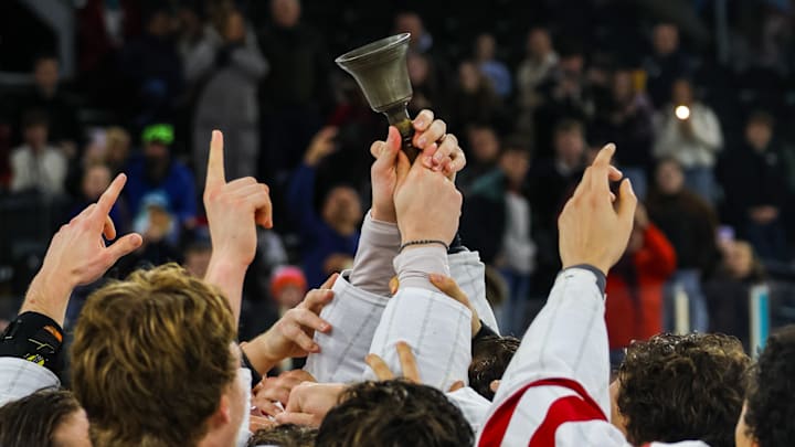 Miami celebrates with the Belpot Trophy after winning the 2025 Friendship Four In Northern Ireland. 