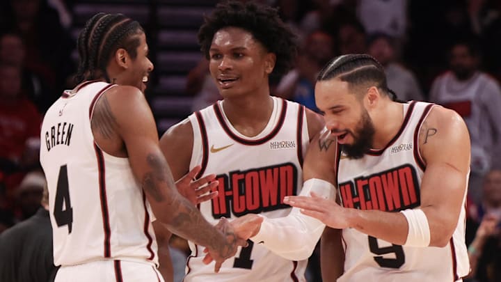 Feb 12, 2025; Houston, Texas, USA; Houston Rockets guard Jalen Green (4) and forward Amen Thompson (1) celebrate with forward Dillon Brooks (9) after a three point basket against the Phoenix Suns in the second half at Toyota Center. Mandatory Credit: Thomas Shea-Imagn Images