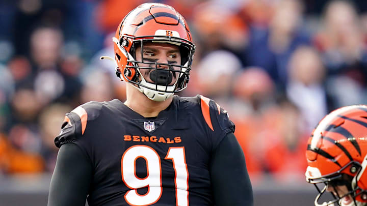 Cincinnati Bengals defensive end Trey Hendrickson (91), left, and Cincinnati Bengals defensive end Sam Hubbard (94) celebrate a sack in the second quarter during a Week 16 NFL game against the Baltimore Ravens, Sunday, Dec. 26, 2021, at Paul Brown Stadium in Cincinnati.