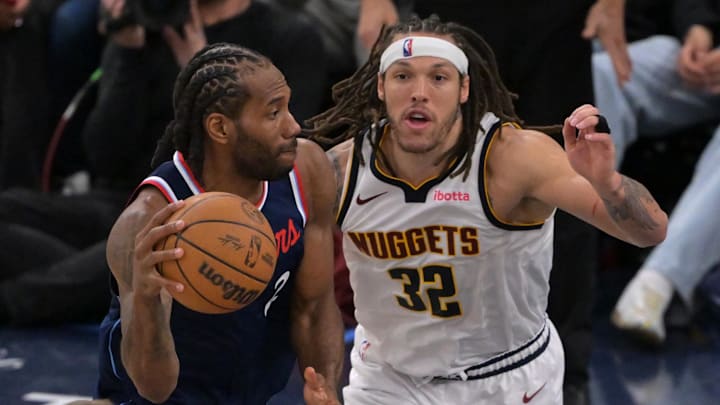 Apr 26, 2025; Inglewood, California, USA;  Los Angeles Clippers forward Kawhi Leonard (2) is defended by Denver Nuggets forward Aaron Gordon (32) in the second half of game four of round one of the 2024 NBA Playoffs at Intuit Dome. Mandatory Credit: Jayne Kamin-Oncea-Imagn Images