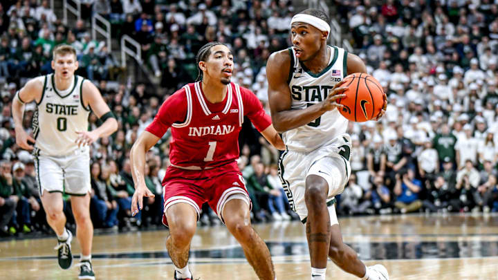 Michigan State's Tre Holloman, right, moves the ball as Indiana's Myles Rice defends during the first half on Tuesday, Feb. 11, 2025, at the Breslin Center in East Lansing.