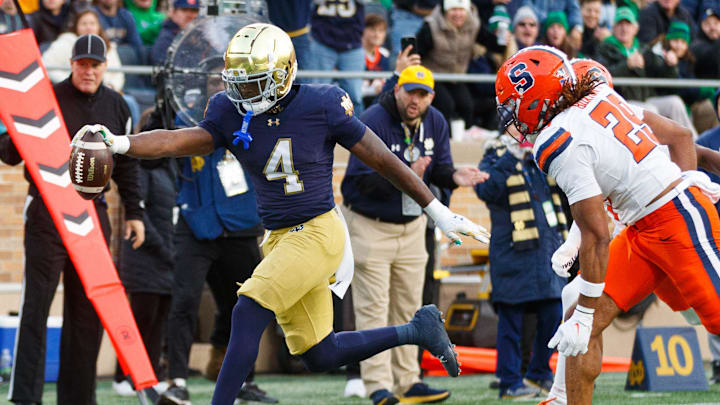 Notre Dame running back Jeremiyah Love (4) runs the ball into the end zone for a touchdown in the first half of a NCAA football game against Syracuse at Notre Dame Stadium on Saturday, Nov. 22, 2025, in South Bend.