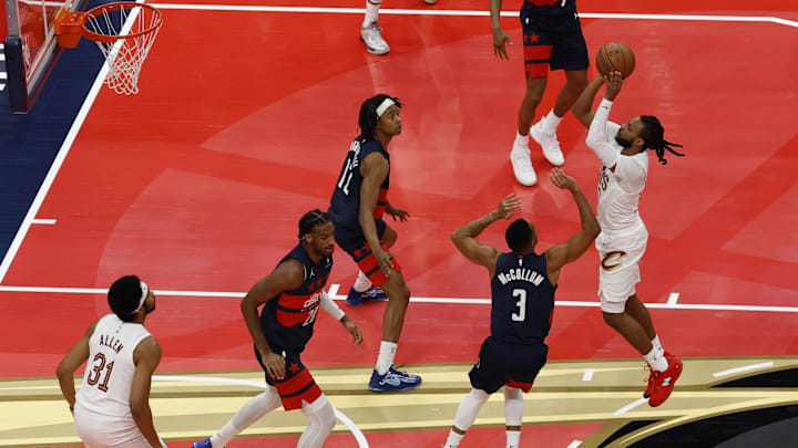 Nov 7, 2025; Washington, District of Columbia, USA; Cleveland Cavaliers guard Darius Garland (10) shoots the ball over Washington Wizards guard CJ McCollum (3) in the first half in an Emirates NBA Cup game at Capital One Arena. Mandatory Credit: Geoff Burke-Imagn Images
