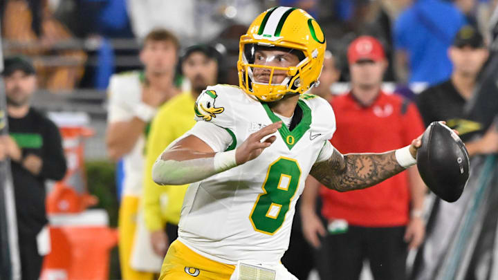 Sep 28, 2024; Pasadena, California, USA; Oregon Ducks quarterback Dillon Gabriel (8) throws a pass during the third quarter against the UCLA Bruins at the Rose Bowl. Mandatory Credit: Robert Hanashiro-Imagn Images